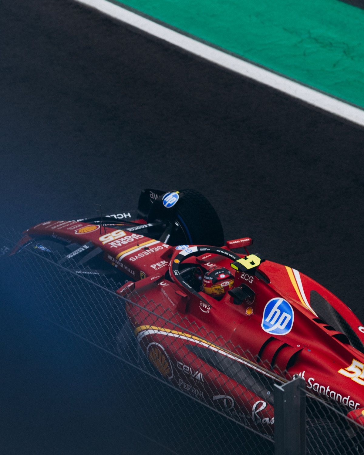 Racing driver with helmet in the cockpit of a formula race car